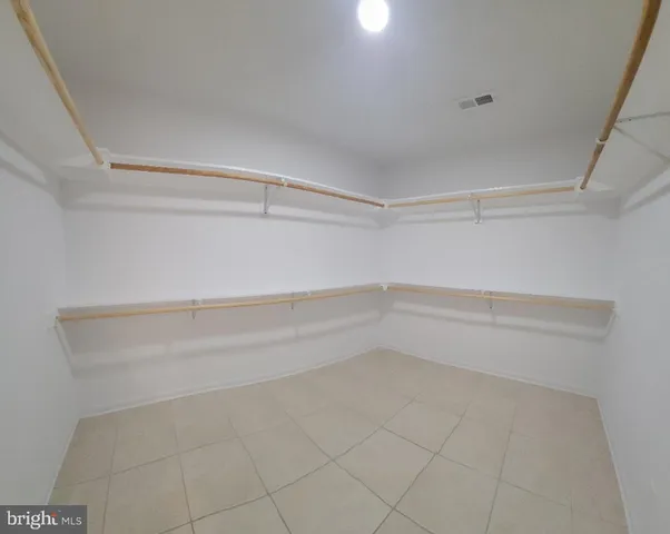 a view of an empty walk in closet