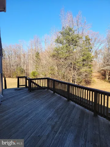 a view of balcony with wooden floor