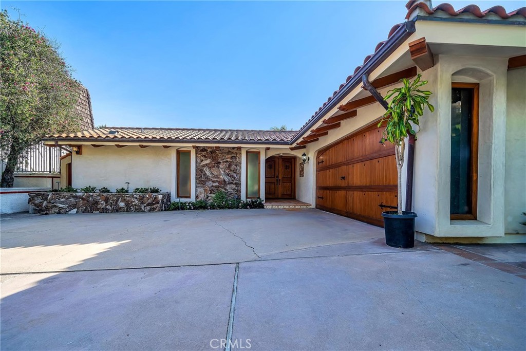 18034 Coastline Drive Malibu, CA 90265 - Photo 2 of 24 a view of a house with a yard
