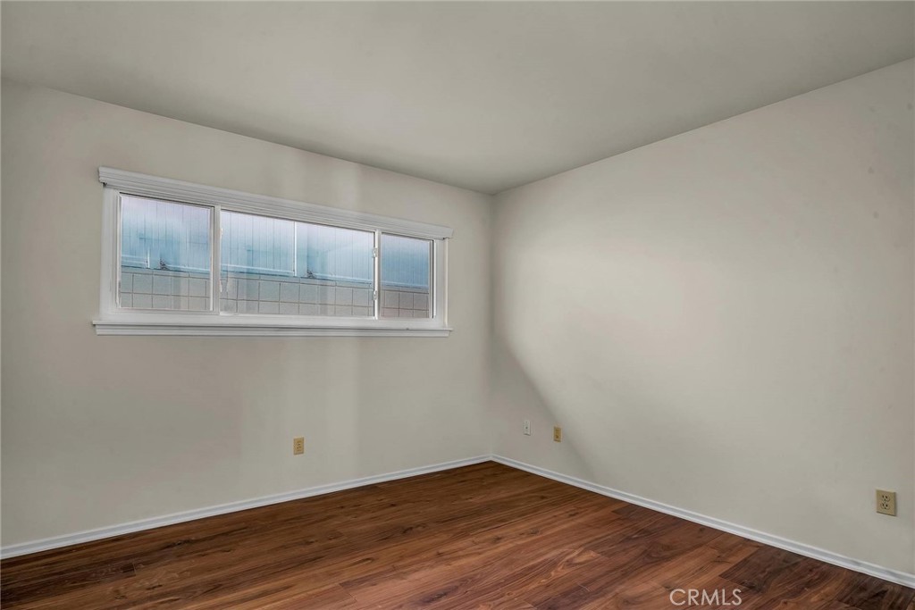 18034 Coastline Drive Malibu, CA 90265 - Photo 22 of 24 a view of empty room with wooden floor and fan