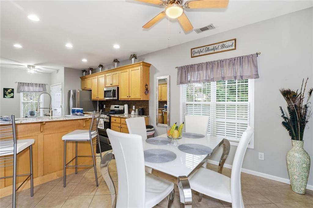 170 Sable Trace Trail Acworth, GA 30102 - Photo 13 of 48 a view of a dining room with furniture window and outside view
