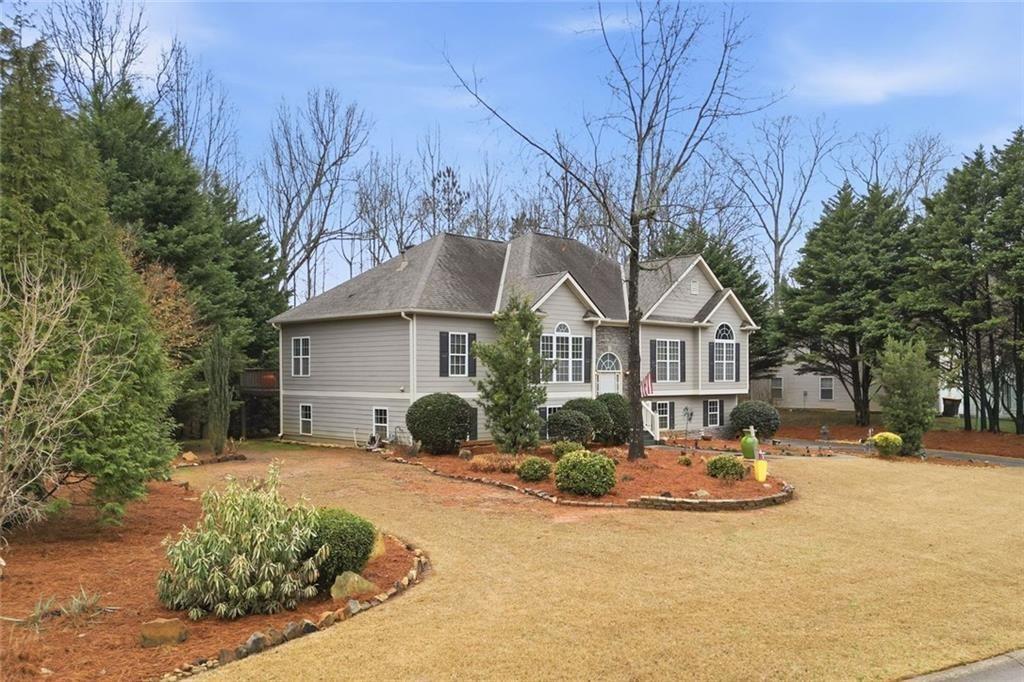 170 Sable Trace Trail Acworth, GA 30102 - Photo 2 of 48 a view of a white house with a yard covered in snow