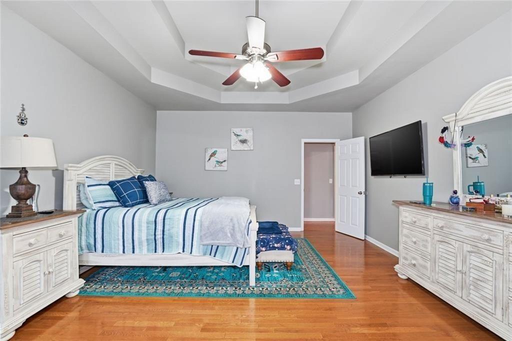170 Sable Trace Trail Acworth, GA 30102 - Photo 22 of 48 a spacious bedroom with a bed and a flat screen tv