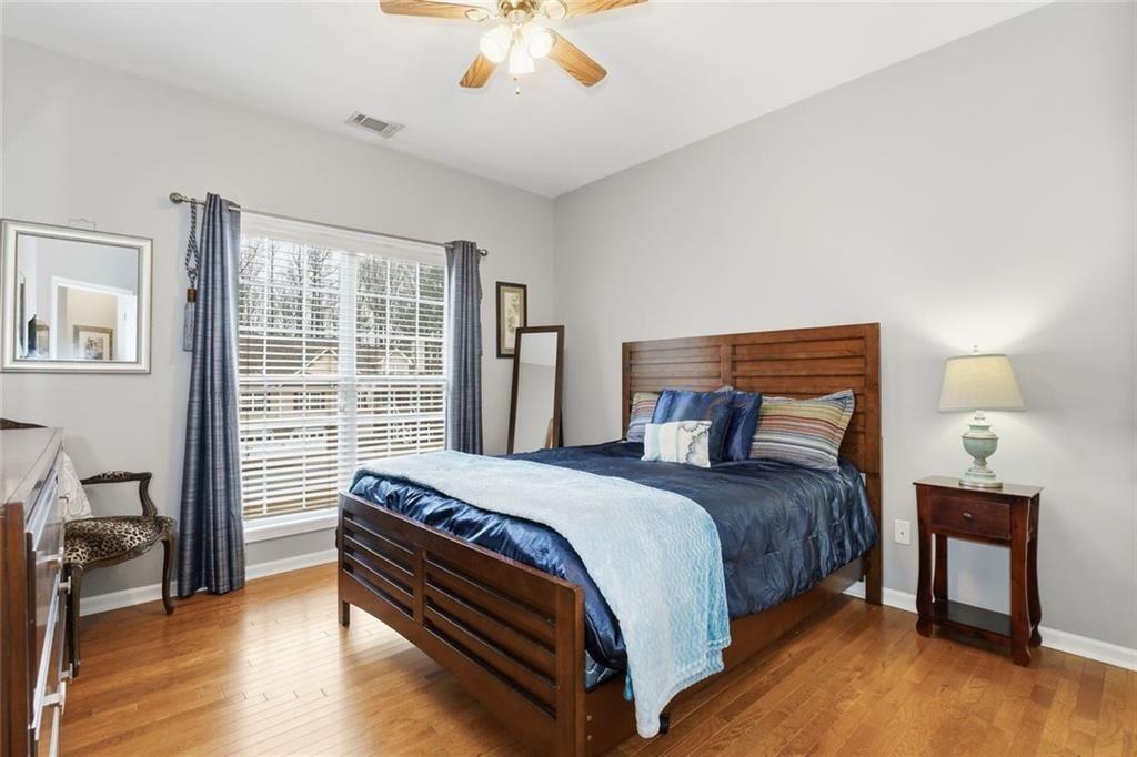 170 Sable Trace Trail Acworth, GA 30102 - Photo 25 of 48 a bedroom with a bed and wooden floor