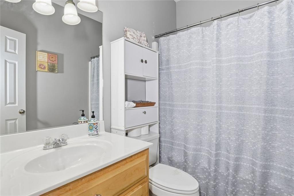 170 Sable Trace Trail Acworth, GA 30102 - Photo 30 of 48 a bathroom with a sink a toilet and shower curtain