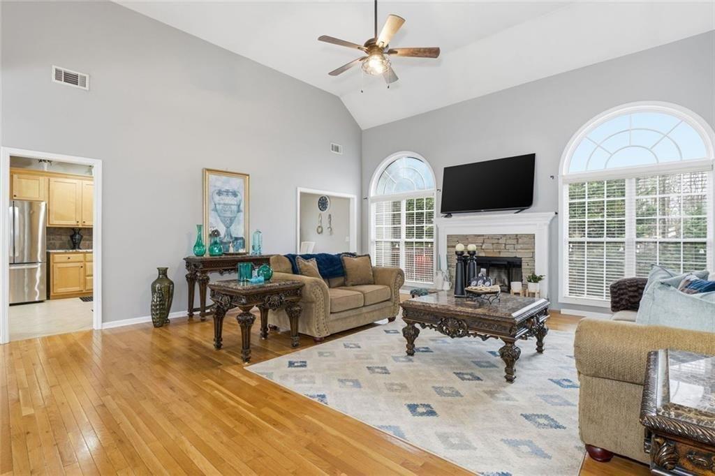 170 Sable Trace Trail Acworth, GA 30102 - Photo 6 of 48 a living room with furniture a fireplace and a flat screen tv