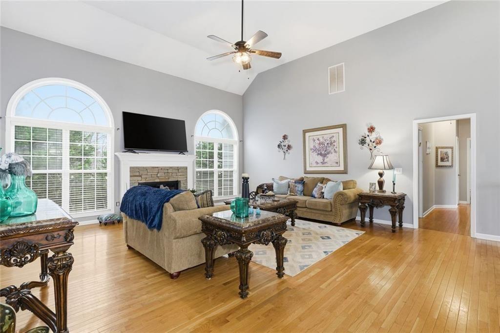170 Sable Trace Trail Acworth, GA 30102 - Photo 8 of 48 a living room with furniture a fireplace and a flat screen tv