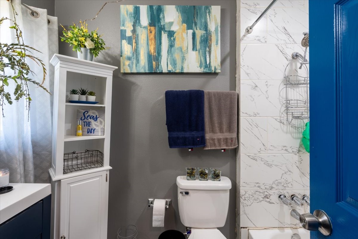 10601 Buffum Street Houston, TX 77051 - Photo 24 of 50 a bathroom with a toilet and a sink