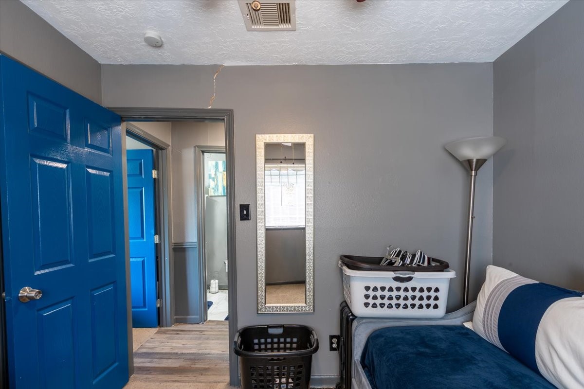 10601 Buffum Street Houston, TX 77051 - Photo 27 of 50 a view of a hallway with wooden floor and cabinet