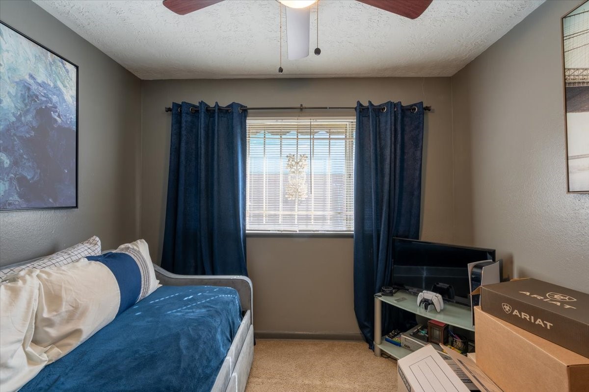 10601 Buffum Street Houston, TX 77051 - Photo 29 of 50 a bedroom with a bed and a window