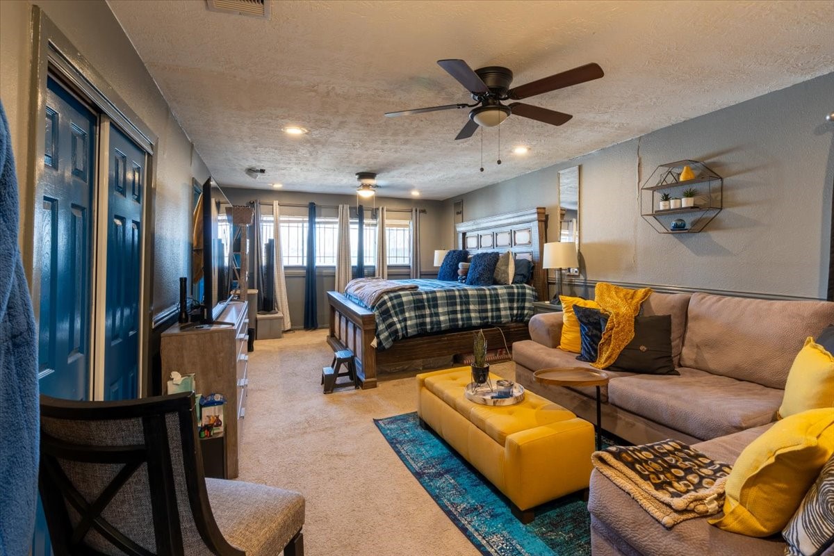 10601 Buffum Street Houston, TX 77051 - Photo 34 of 50 a living room with furniture and a ceiling fan