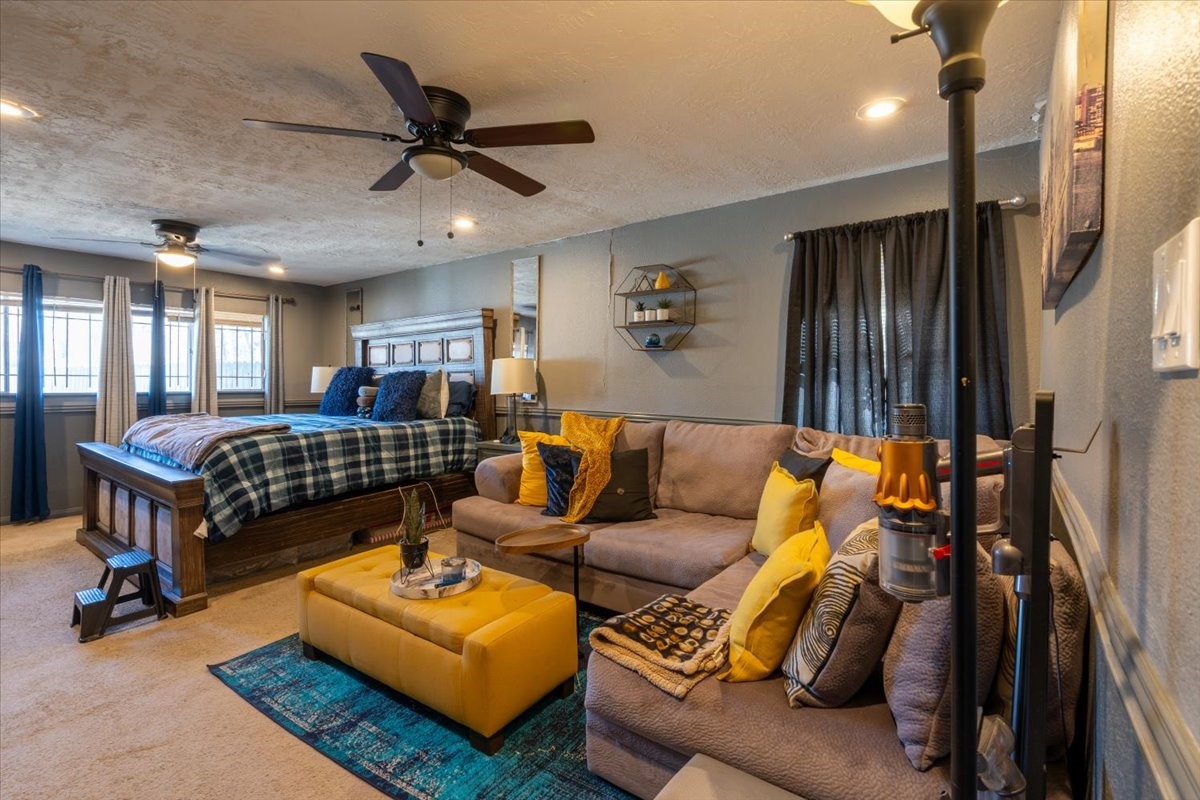 10601 Buffum Street Houston, TX 77051 - Photo 35 of 50 a living room with furniture and a ceiling fan