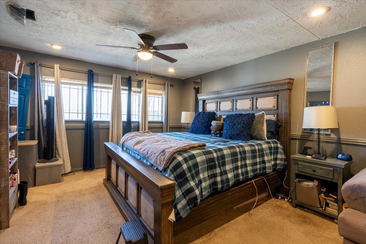 10601 Buffum Street Houston, TX 77051 - Photo 37 of 50 a bedroom with a bed a window and gym equipment