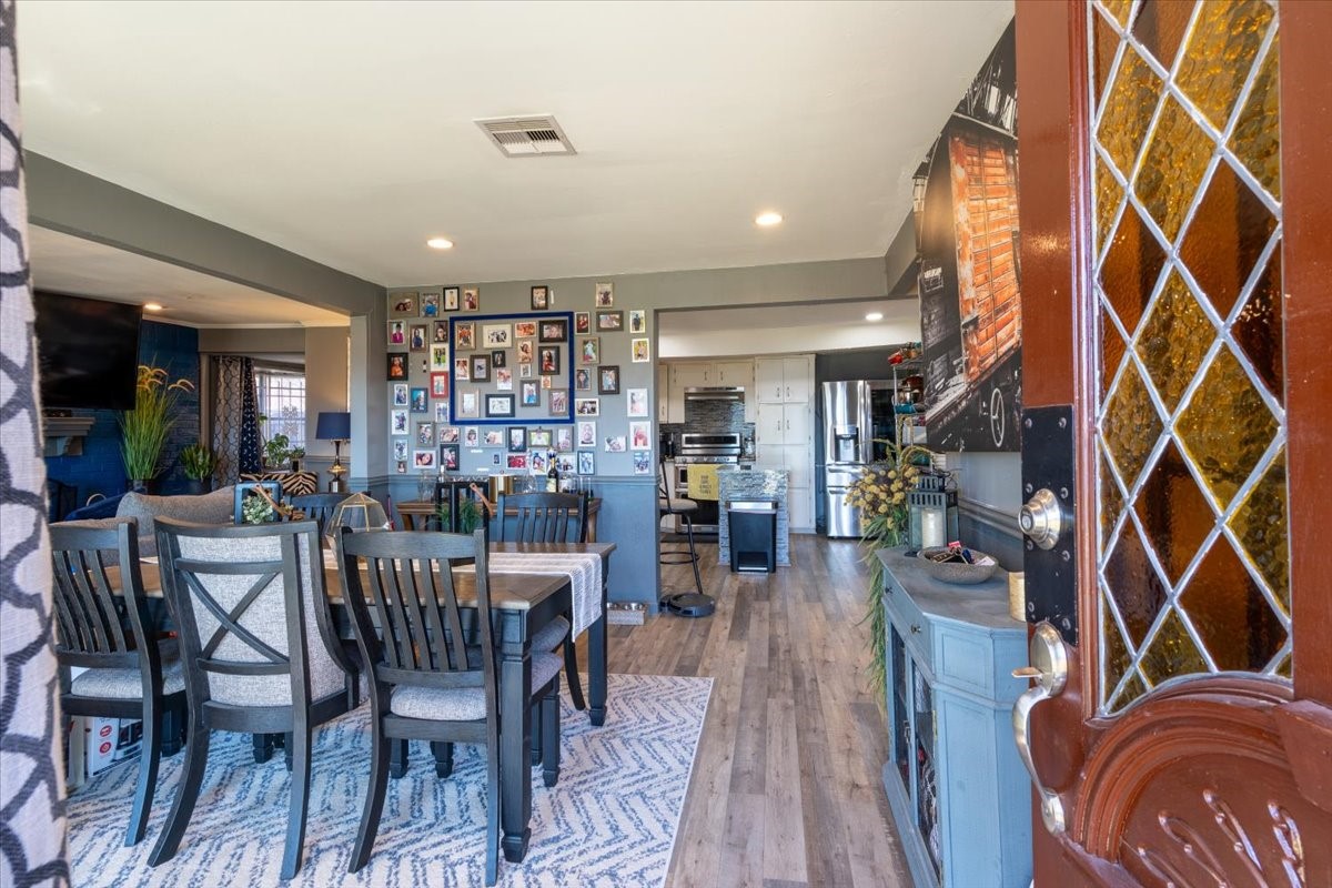10601 Buffum Street Houston, TX 77051 - Photo 6 of 50 a view of a dining room with furniture and wooden floor