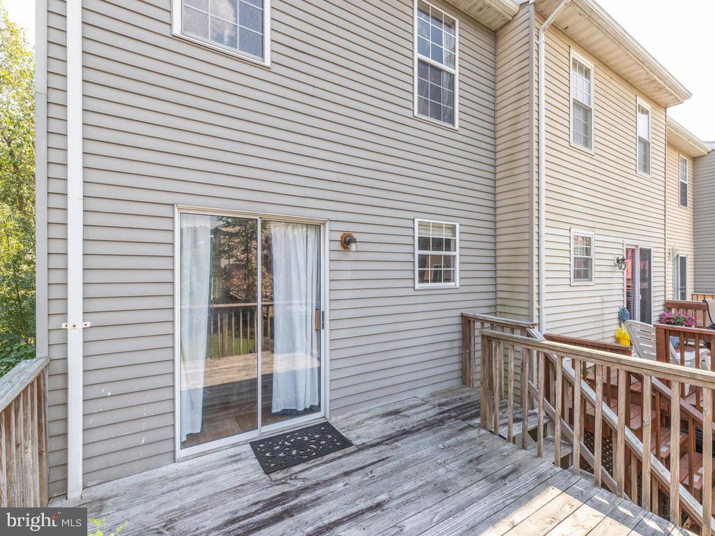 4078 Rustico Road Baltimore, MD 21220 - Photo 10 of 40 Dining room sliding doors open to wood deck