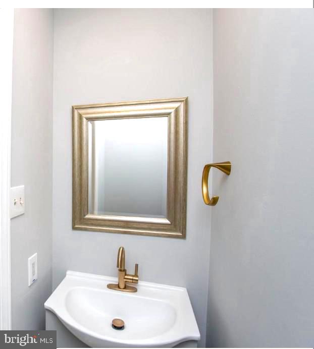 2 Washington Square Doylestown, PA 18901 - Photo 11 of 27 a bathroom with a sink and mirror