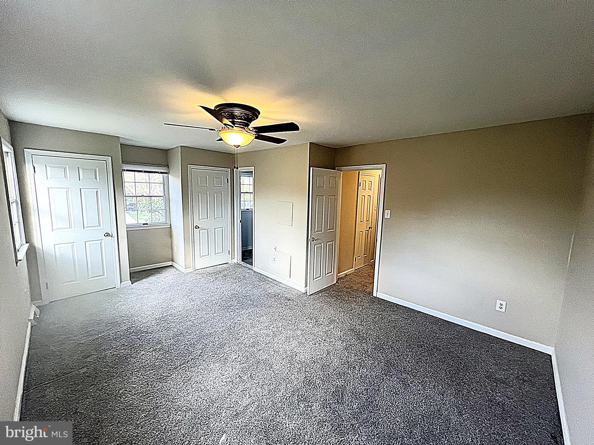 2 Washington Square Doylestown, PA 18901 - Photo 13 of 27 a view of a livingroom with a chandelier fan and a window