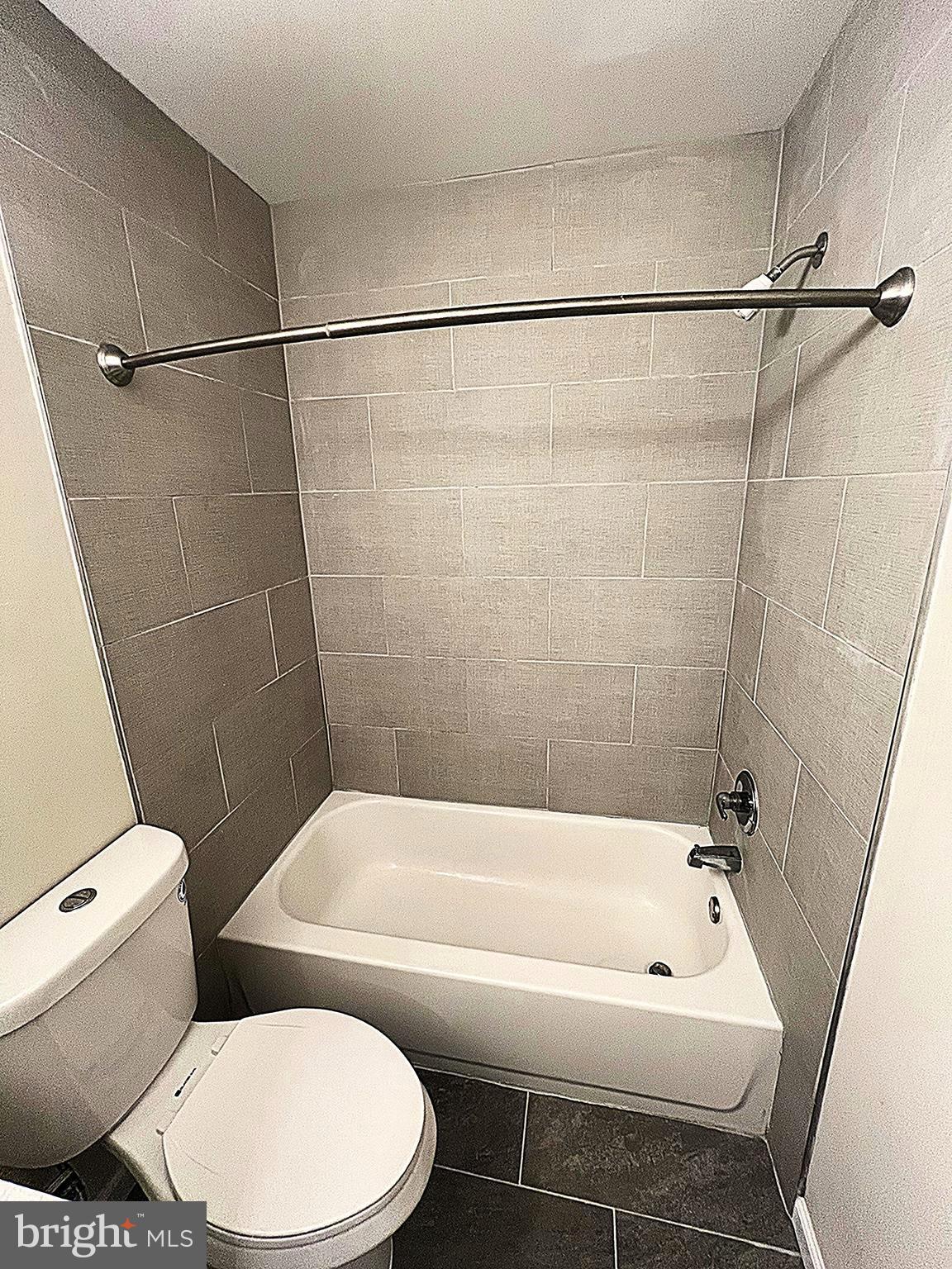 2 Washington Square Doylestown, PA 18901 - Photo 19 of 27 a bathroom with a toilet and a bathtub