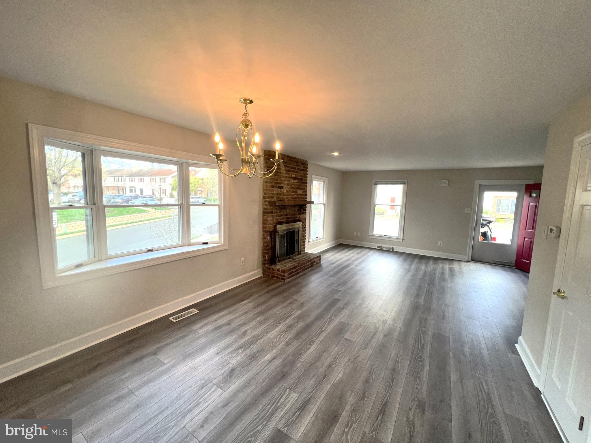 2 Washington Square Doylestown, PA 18901 - Photo 6 of 27 an empty room with wooden floor and windows