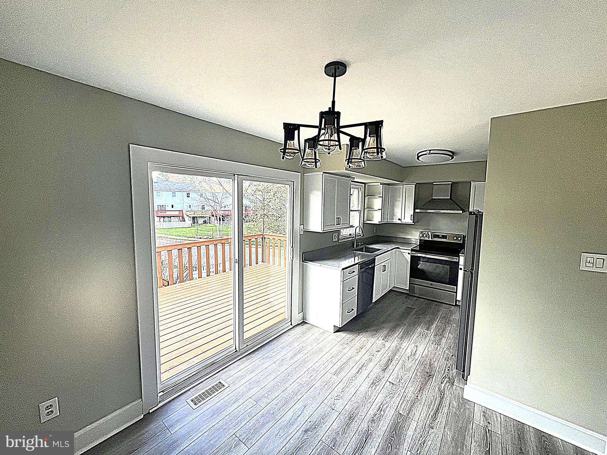 2 Washington Square Doylestown, PA 18901 - Photo 7 of 27 a kitchen with stainless steel appliances a refrigerator and a stove top oven