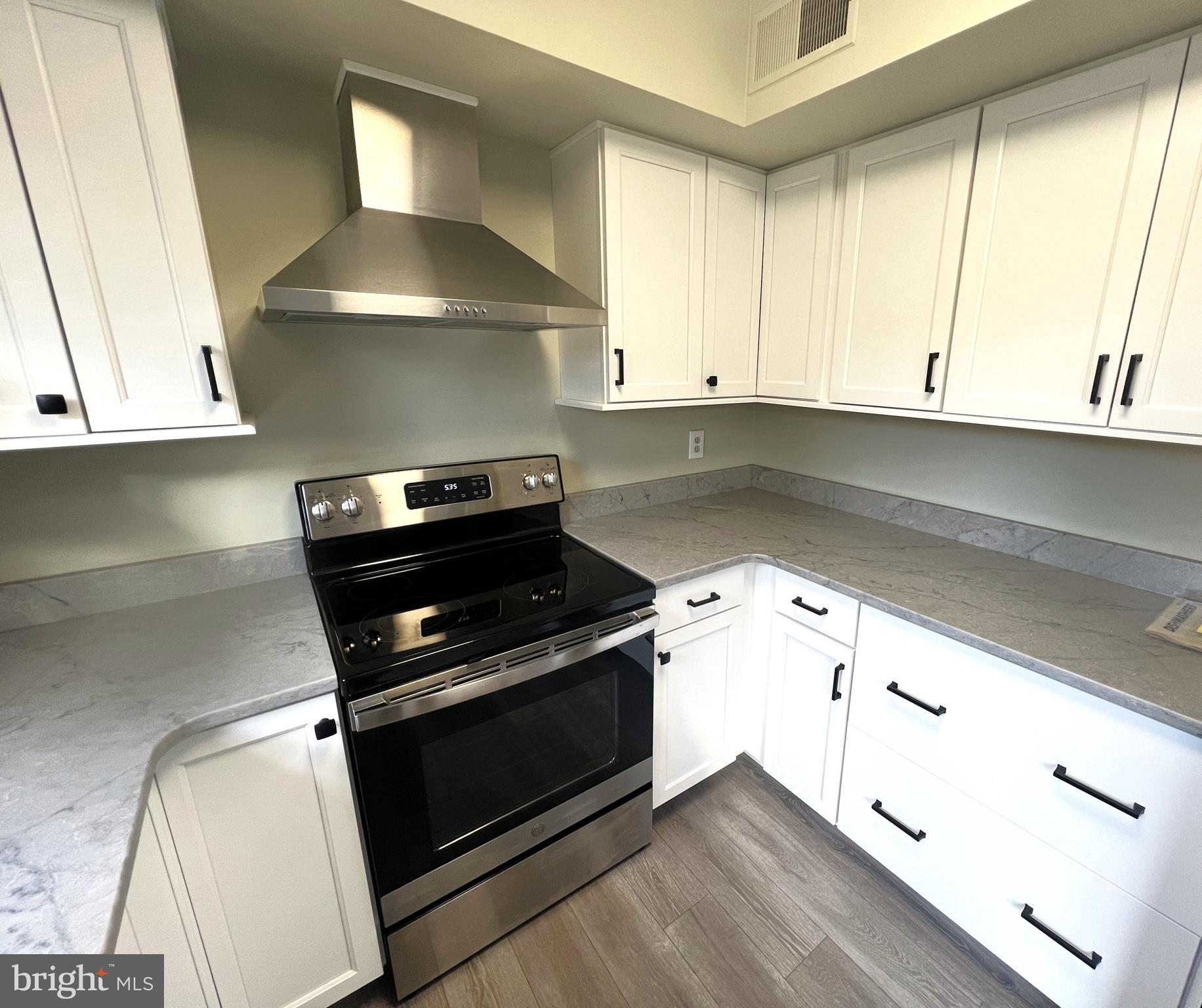 2 Washington Square Doylestown, PA 18901 - Photo 9 of 27 a kitchen with granite countertop a stove and a sink