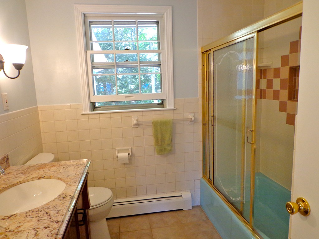 16 Juniper Lane Rutland, MA 01543 - Photo 12 of 22 a bathroom with a granite countertop sink toilet and shower
