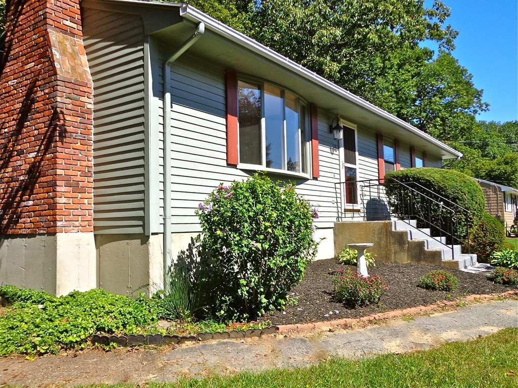 16 Juniper Lane Rutland, MA 01543 - Photo 22 of 22 a front view of a house with a yard