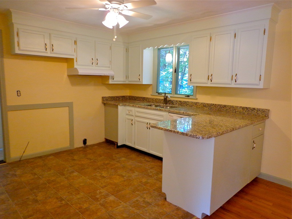 16 Juniper Lane Rutland, MA 01543 - Photo 3 of 22 a kitchen with stainless steel appliances granite countertop a sink a stove top oven a counter space and cabinets