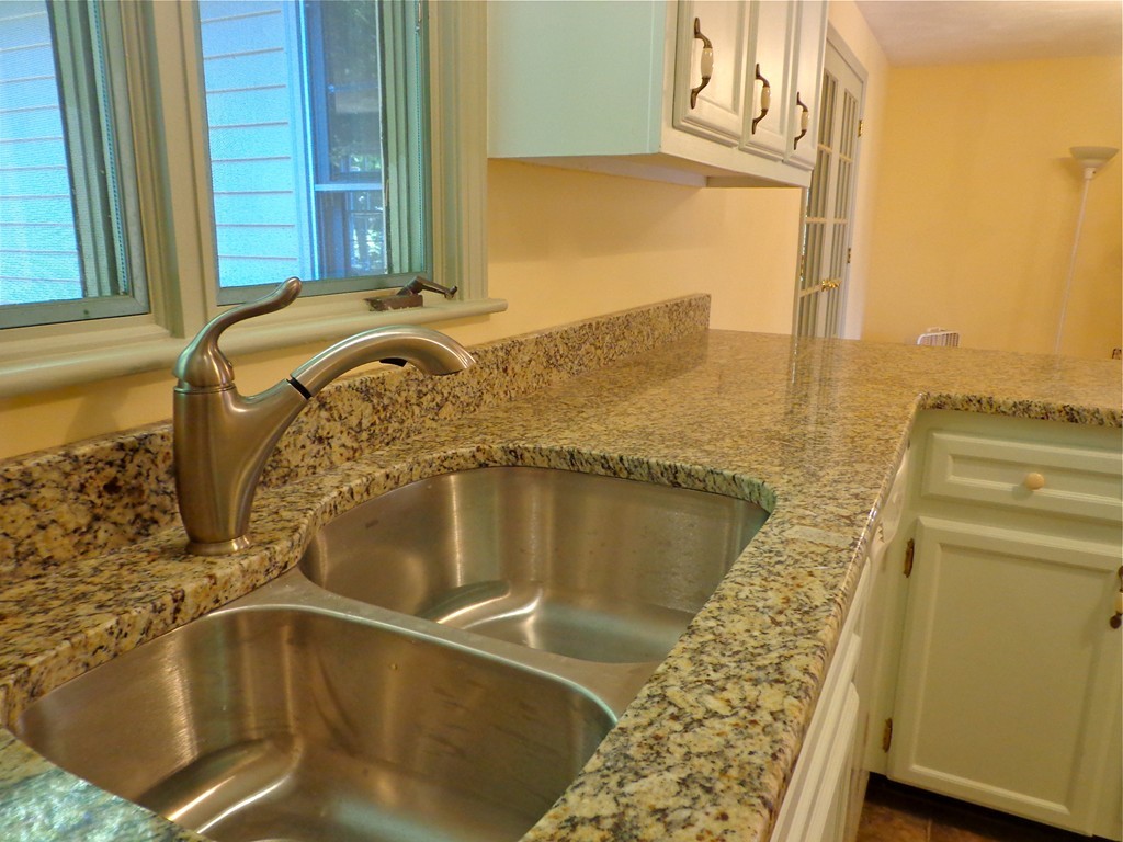 16 Juniper Lane Rutland, MA 01543 - Photo 4 of 22 a bathroom with a granite countertop sink and a mirror
