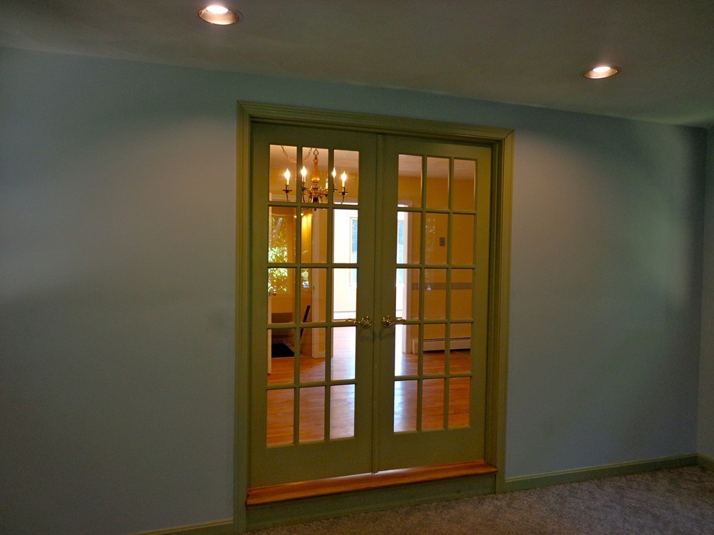 16 Juniper Lane Rutland, MA 01543 - Photo 8 of 22 a view of empty room with floor to ceiling window