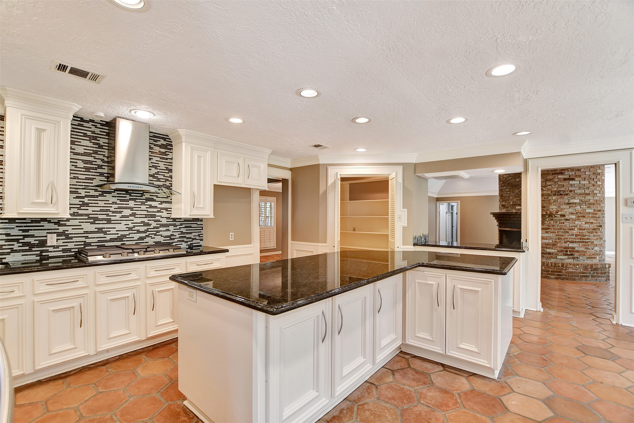 16002 Koenig Lane Conroe, TX 77384 - Photo 14 of 48 a kitchen with granite countertop a sink and cabinets