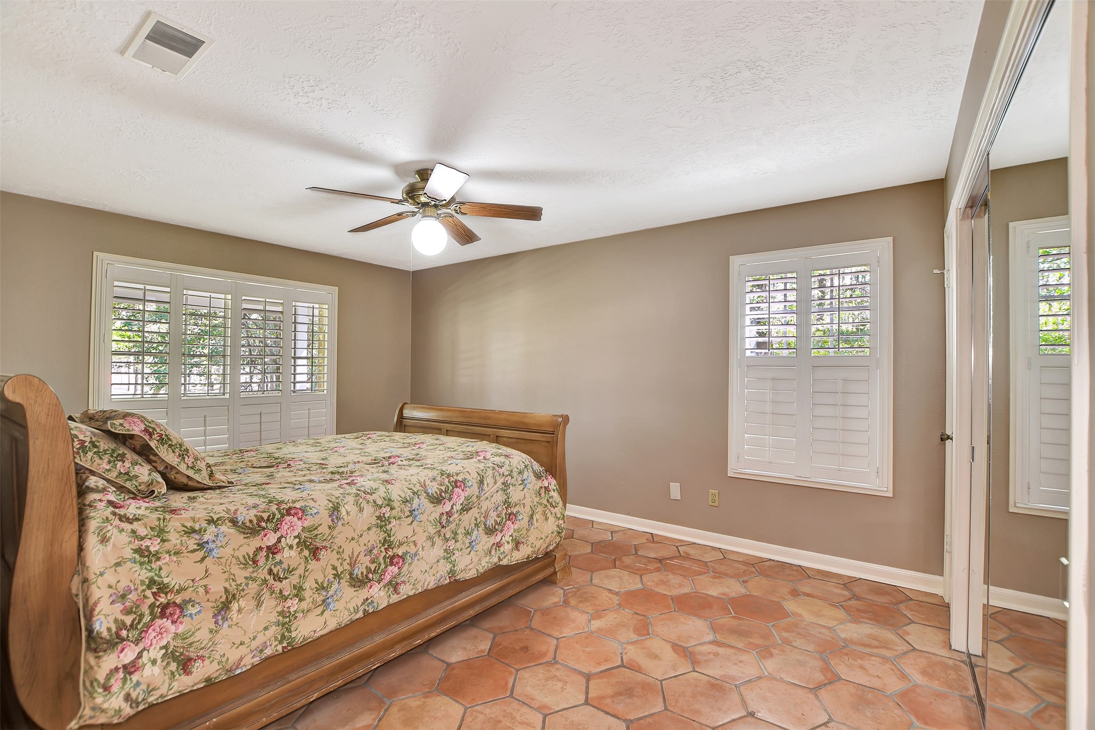 16002 Koenig Lane Conroe, TX 77384 - Photo 25 of 48 a bedroom with a bed and a window
