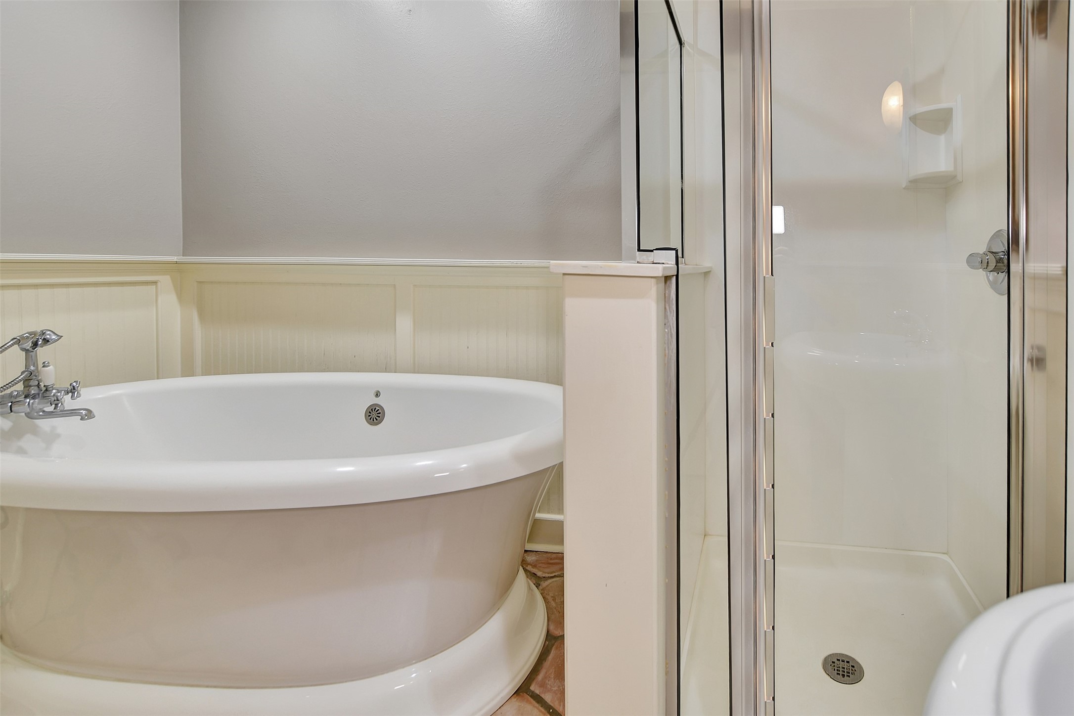 16002 Koenig Lane Conroe, TX 77384 - Photo 27 of 48 a white bath tub sitting next to a bathroom sink