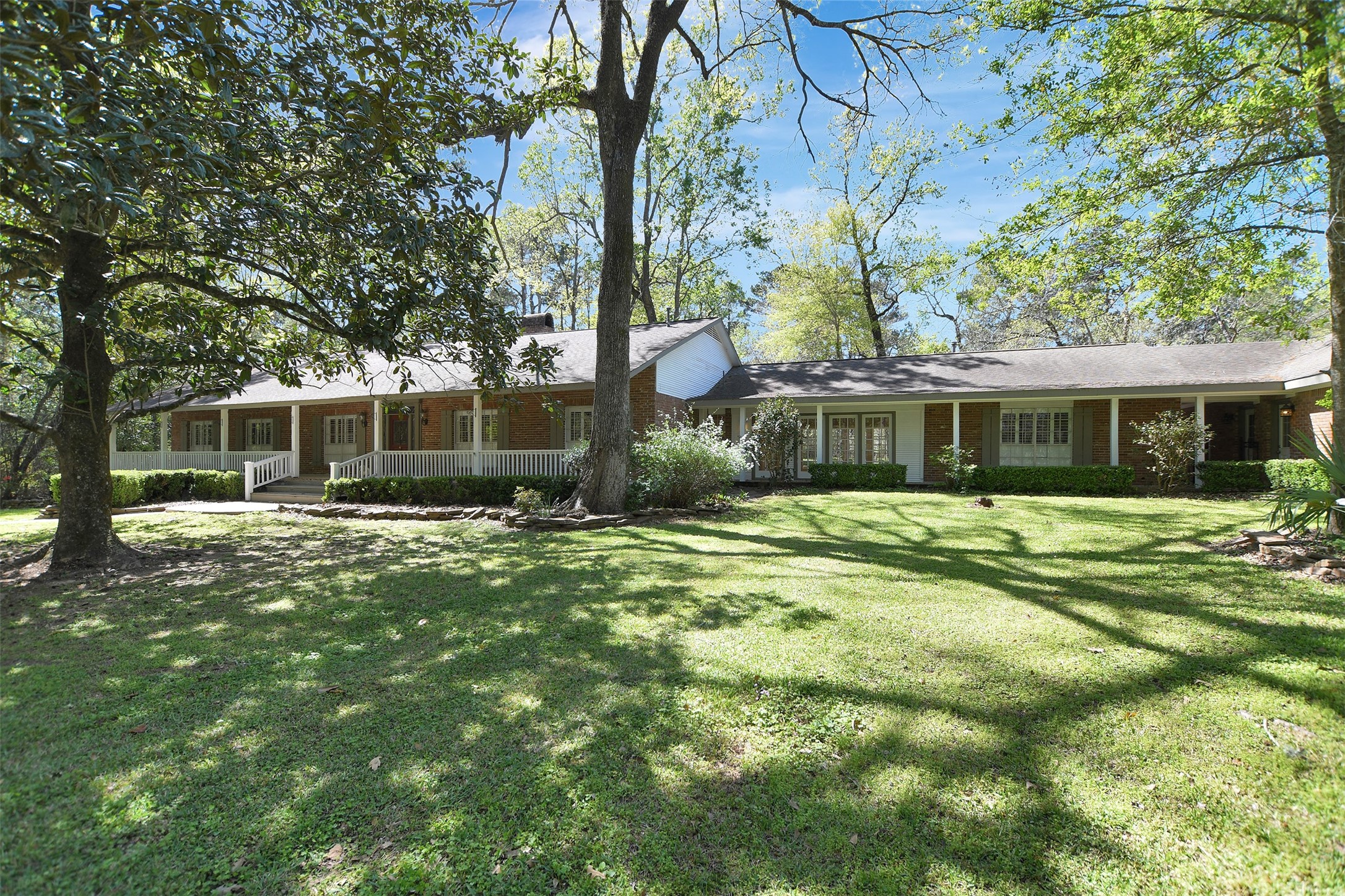 16002 Koenig Lane Conroe, TX 77384 - Photo 3 of 48 a front view of a house with a garden