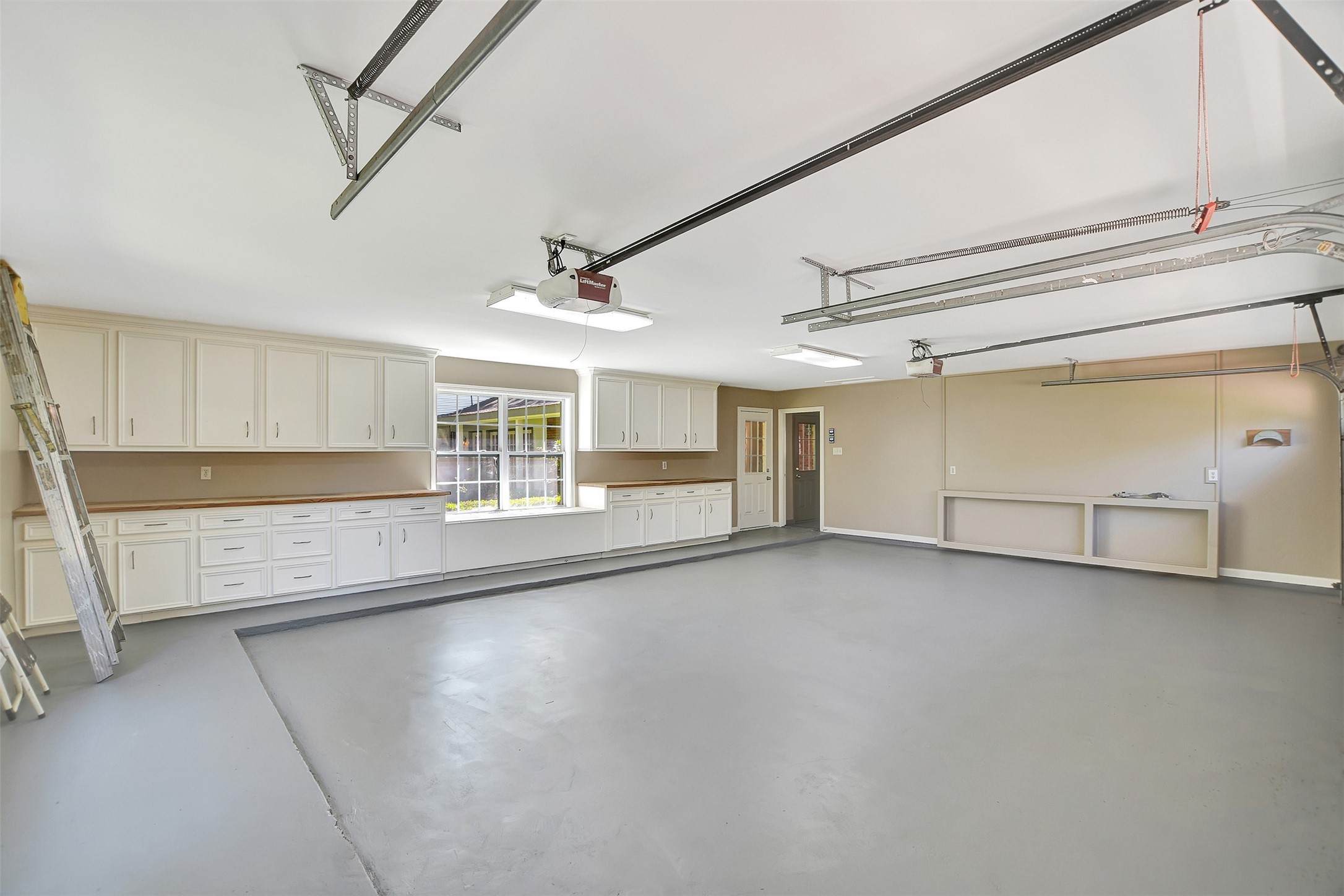 16002 Koenig Lane Conroe, TX 77384 - Photo 34 of 48 Garage with built-in cabinetry