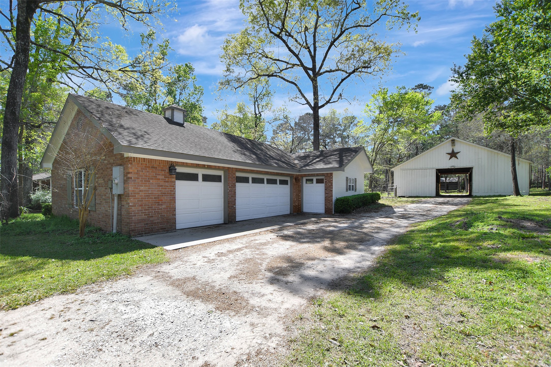 16002 Koenig Lane Conroe, TX 77384 - Photo 40 of 48 a front view of a house with a garden and yard