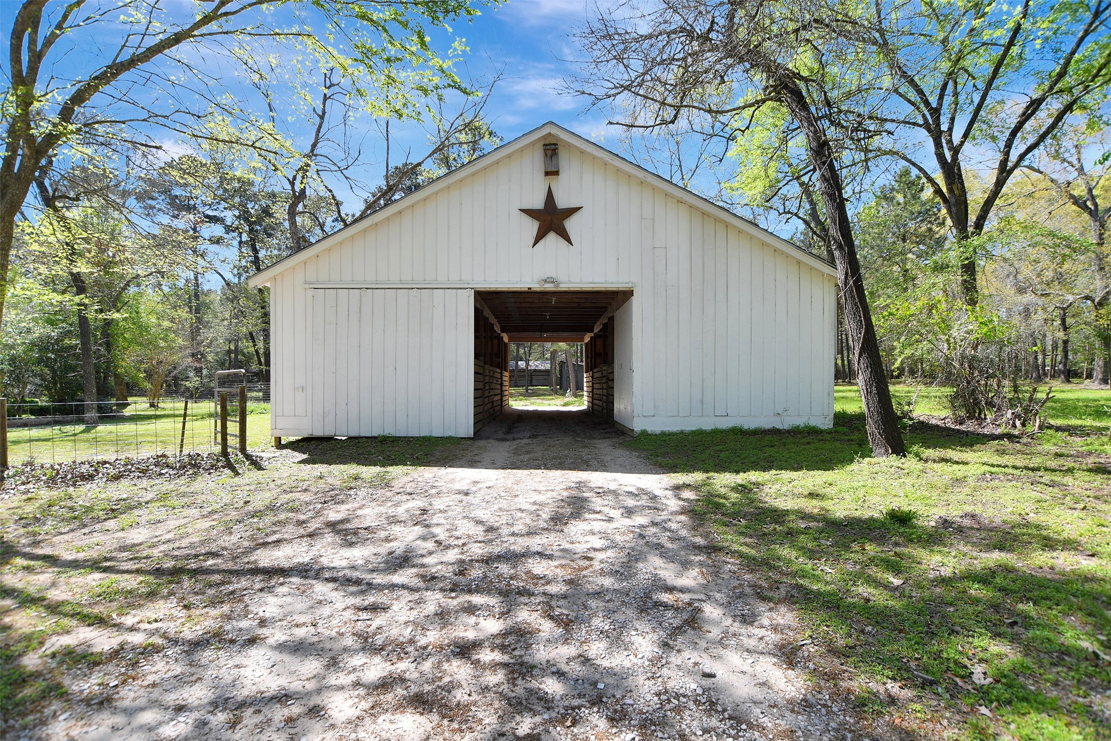 16002 Koenig Lane Conroe, TX 77384 - Photo 41 of 48 a backyard of a house with lots of green space