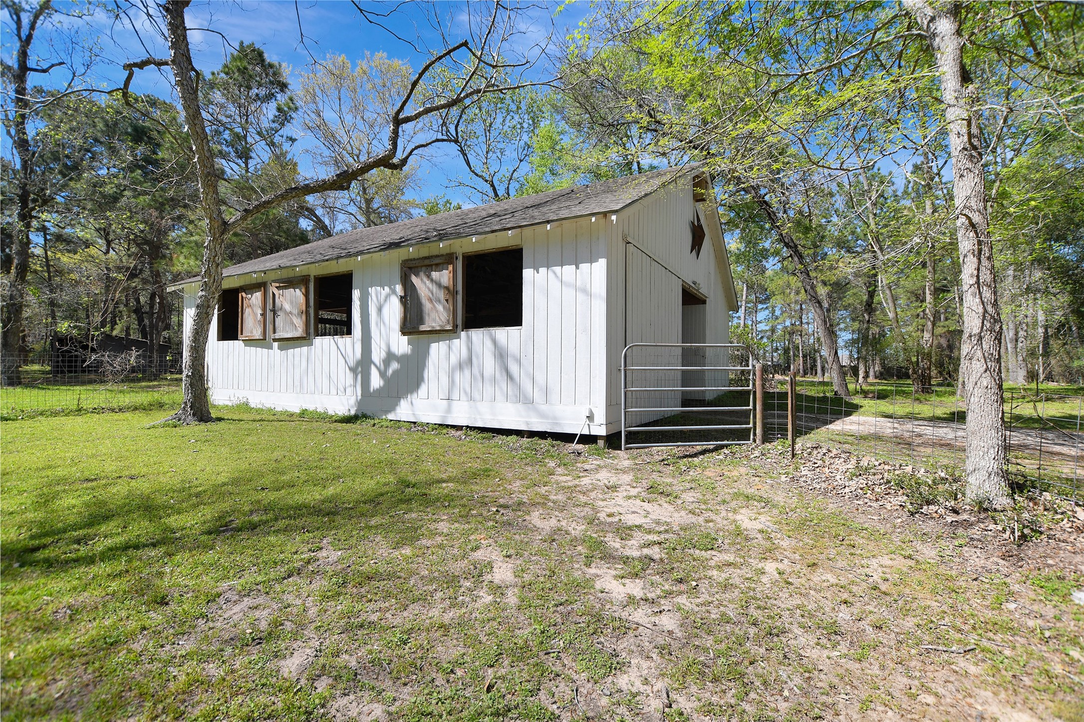 16002 Koenig Lane Conroe, TX 77384 - Photo 42 of 48 a view of a house with backyard