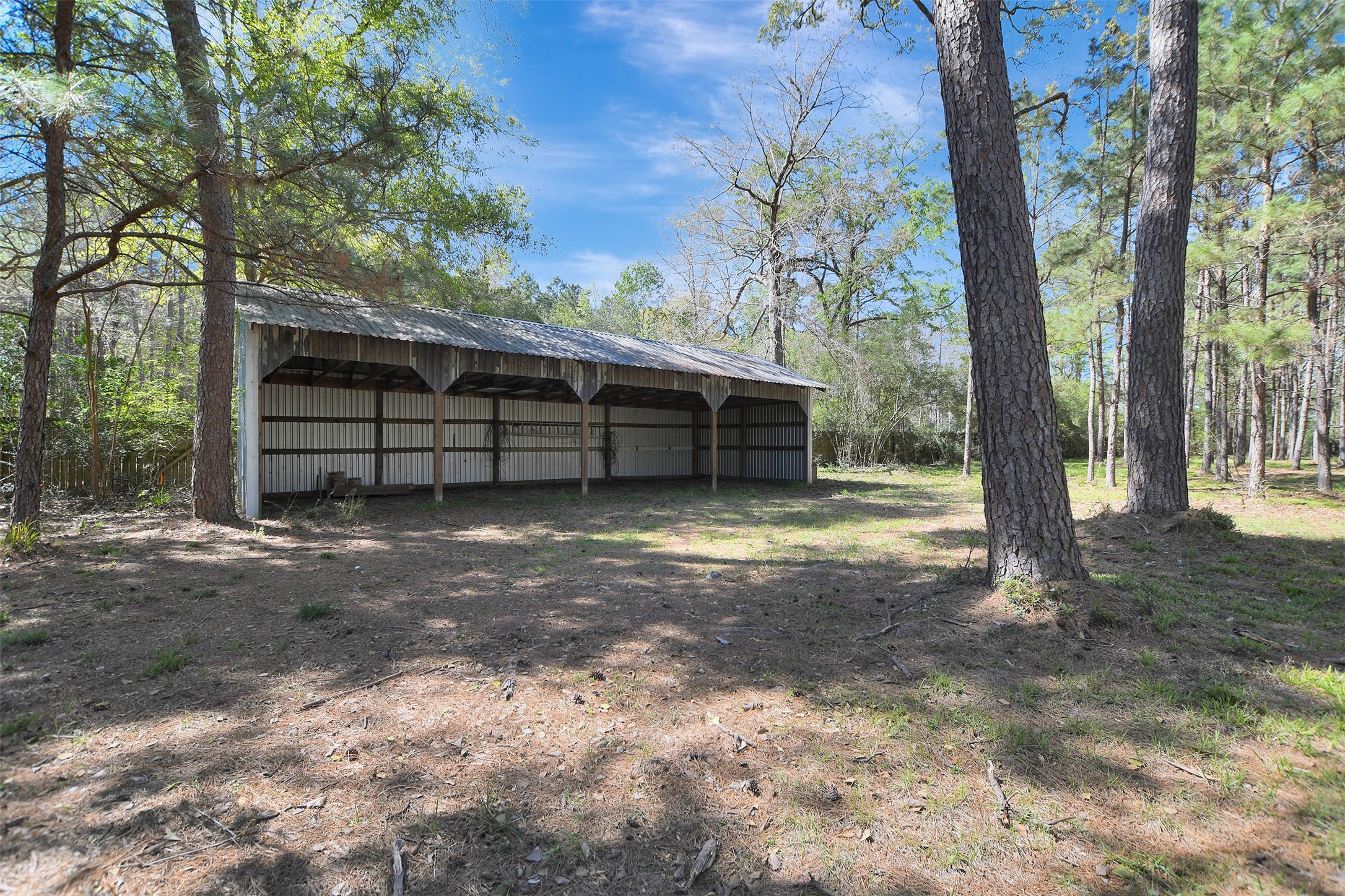 16002 Koenig Lane Conroe, TX 77384 - Photo 44 of 48 a view of a house with a yard and garage