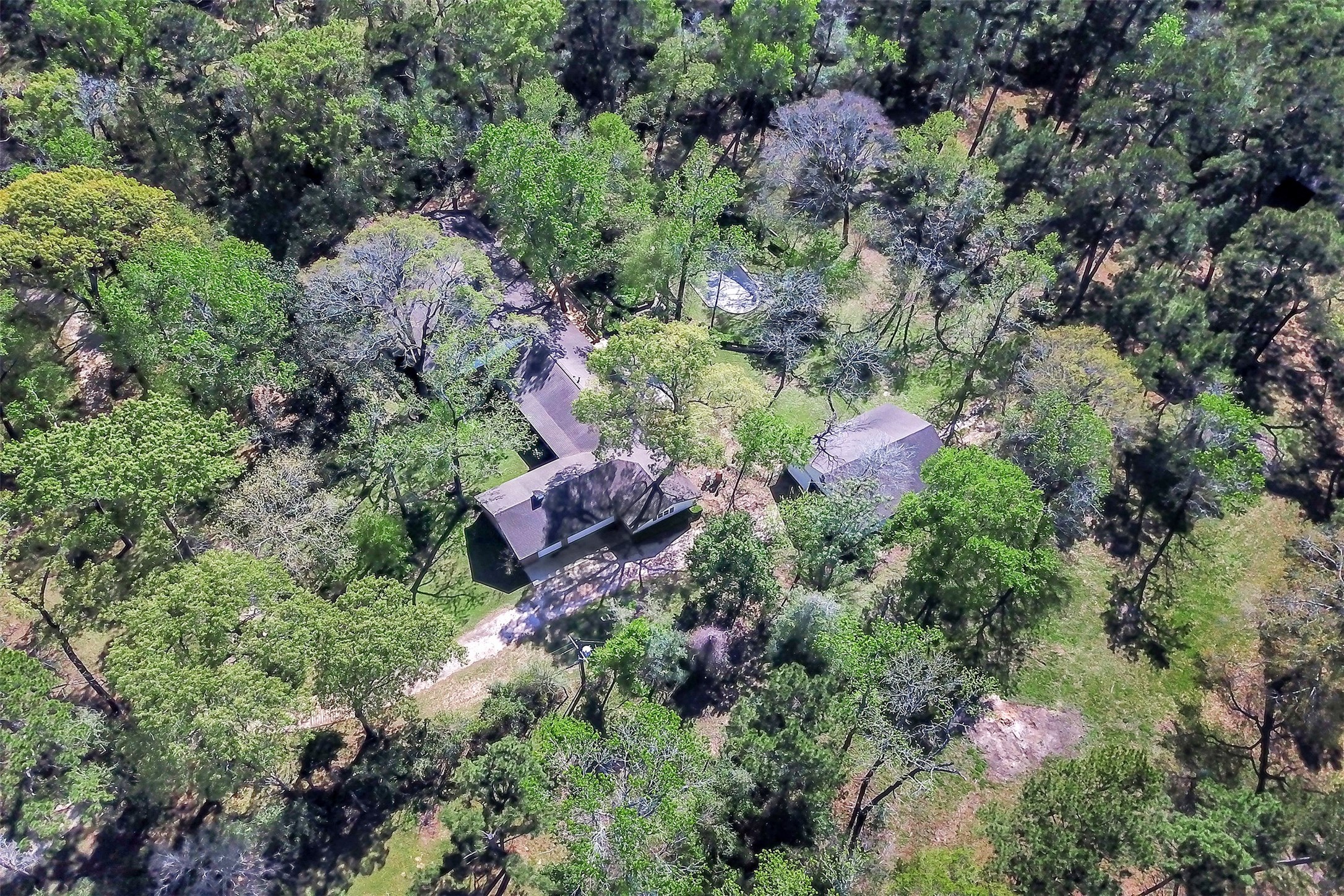 16002 Koenig Lane Conroe, TX 77384 - Photo 46 of 48 an aerial view of house with yard and outdoor seating