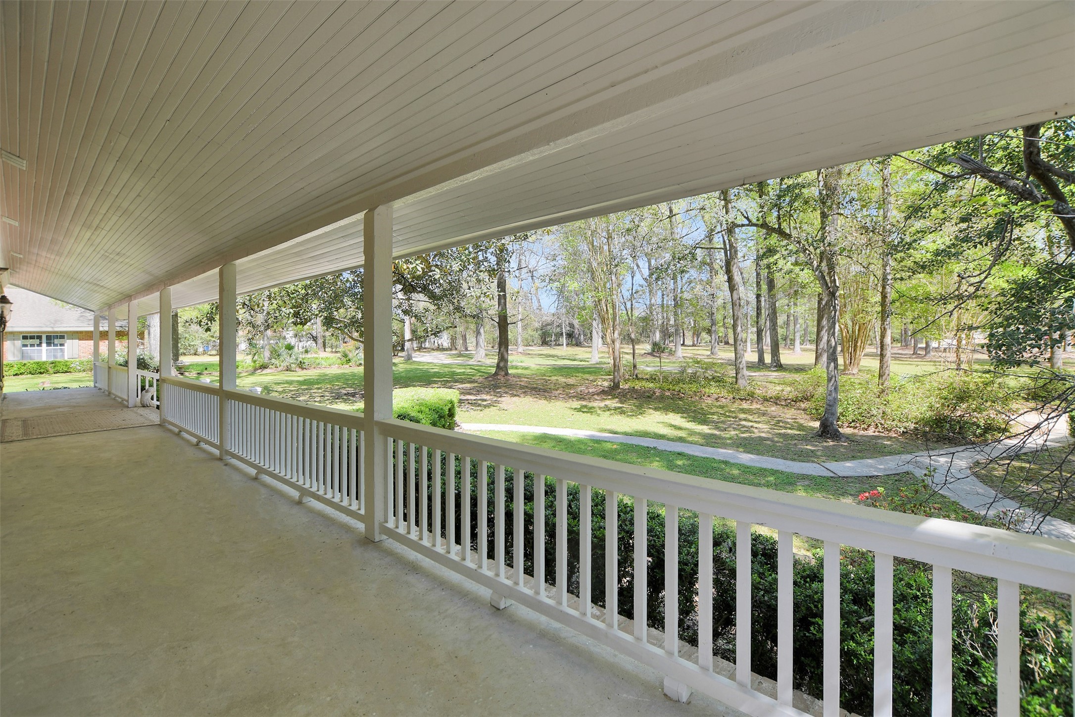 16002 Koenig Lane Conroe, TX 77384 - Photo 6 of 48 a view of a porch with wooden floor and outdoor space