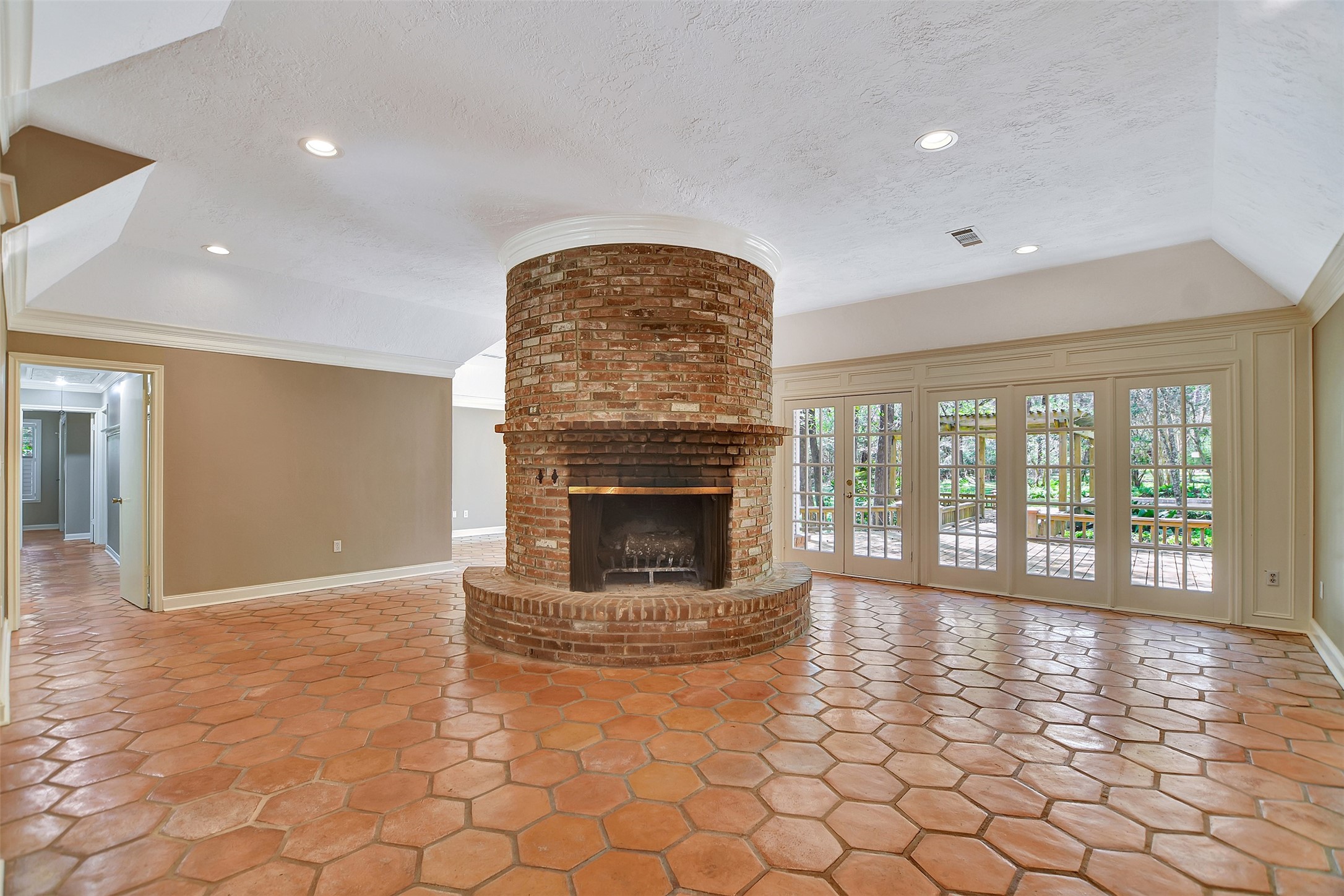 16002 Koenig Lane Conroe, TX 77384 - Photo 10 of 48 a view of an empty room with a fireplace