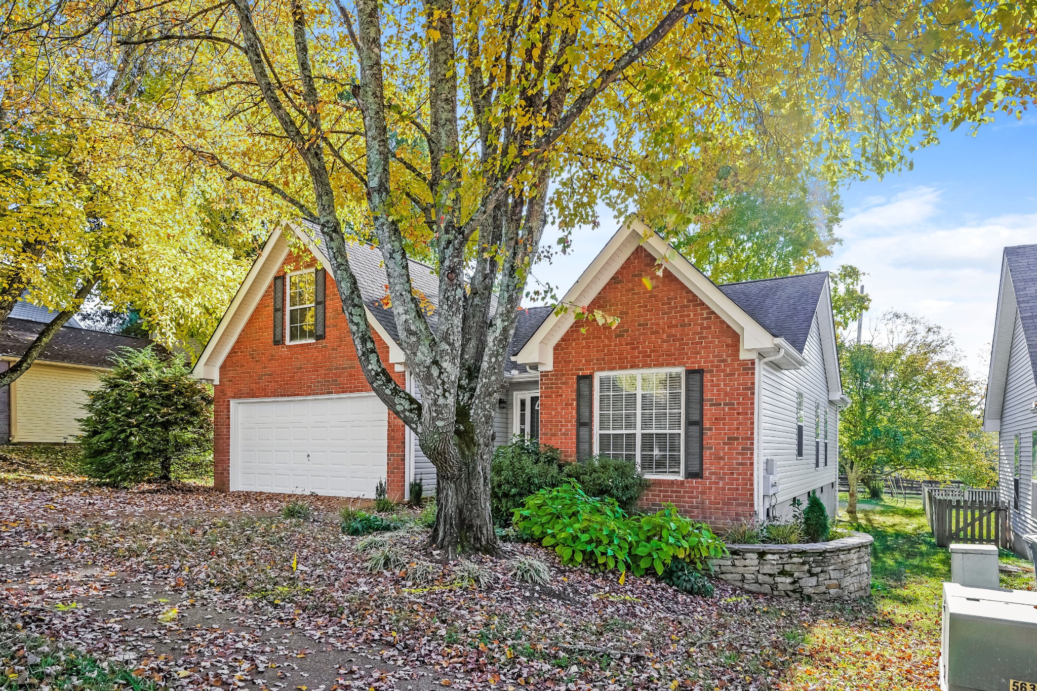 306 Crooked Oak Court Franklin, TN 37067 - Photo 2 of 27 a front view of a house with yard and green space
