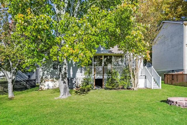 a view of a house with a tree
