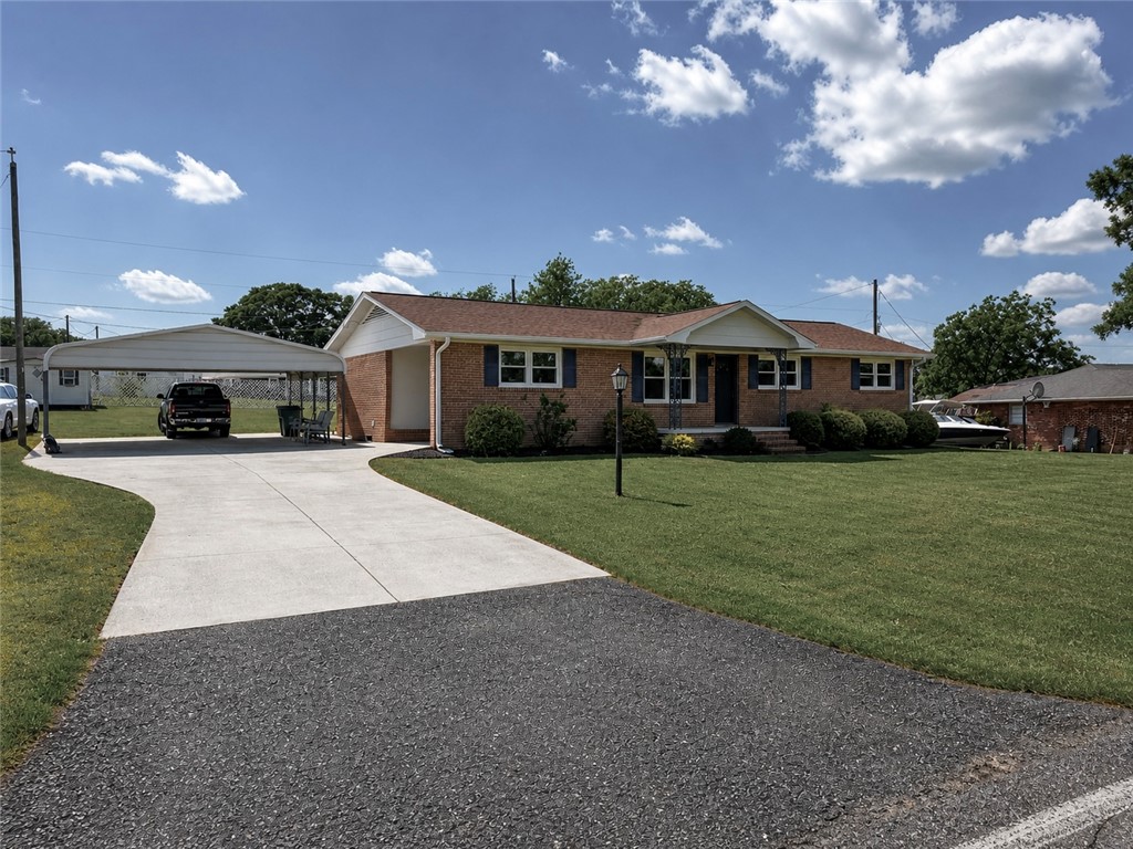 This charming home offers a spacious yard and ample parking for comfortable living.