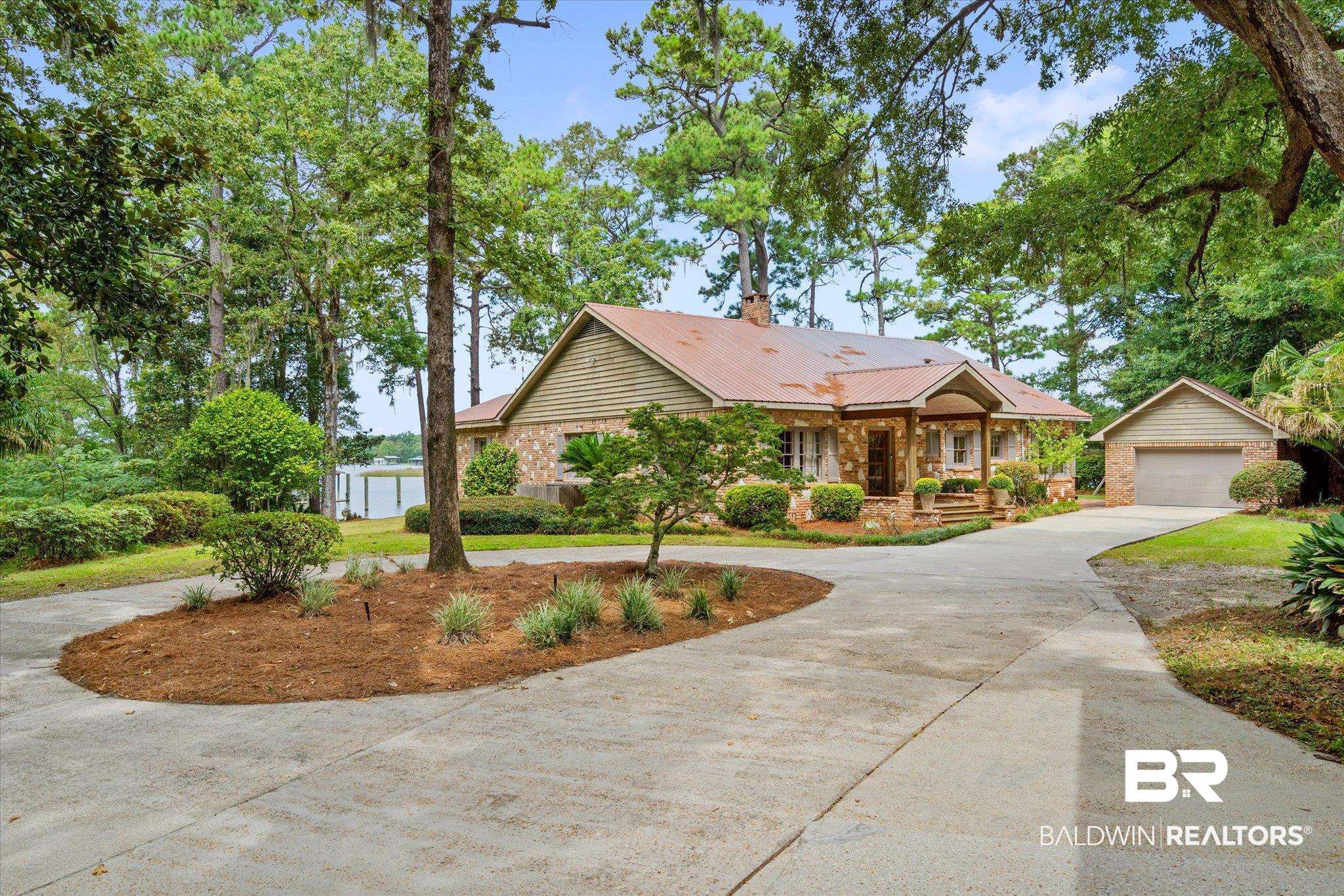 2228 Riverside Drive Mobile, AL 36605 - Photo 35 of 51 View of front of house featuring a garage and a porch