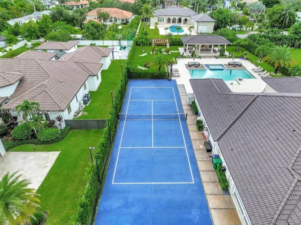 a view of a swimming pool with a table and chairs
