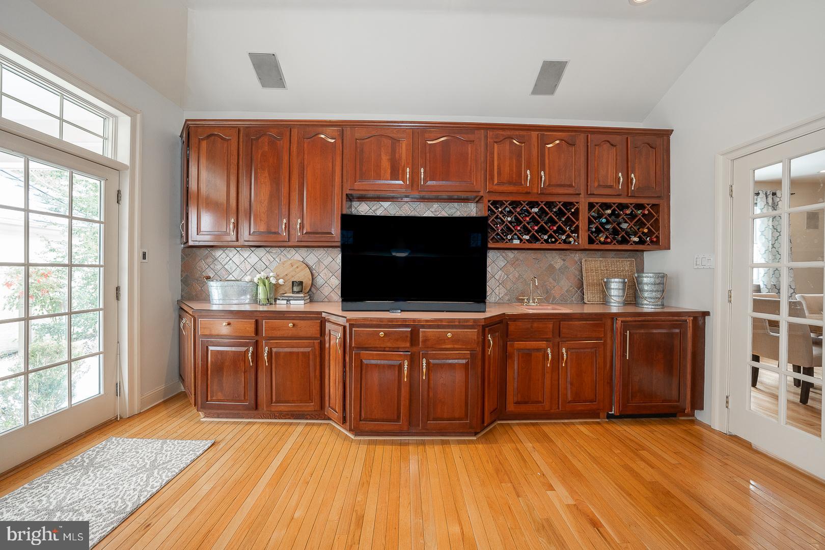 400 Orchard Way Wayne, PA 19087 - Photo 13 of 60 a kitchen with stainless steel appliances granite countertop wooden cabinets a stove and a sink