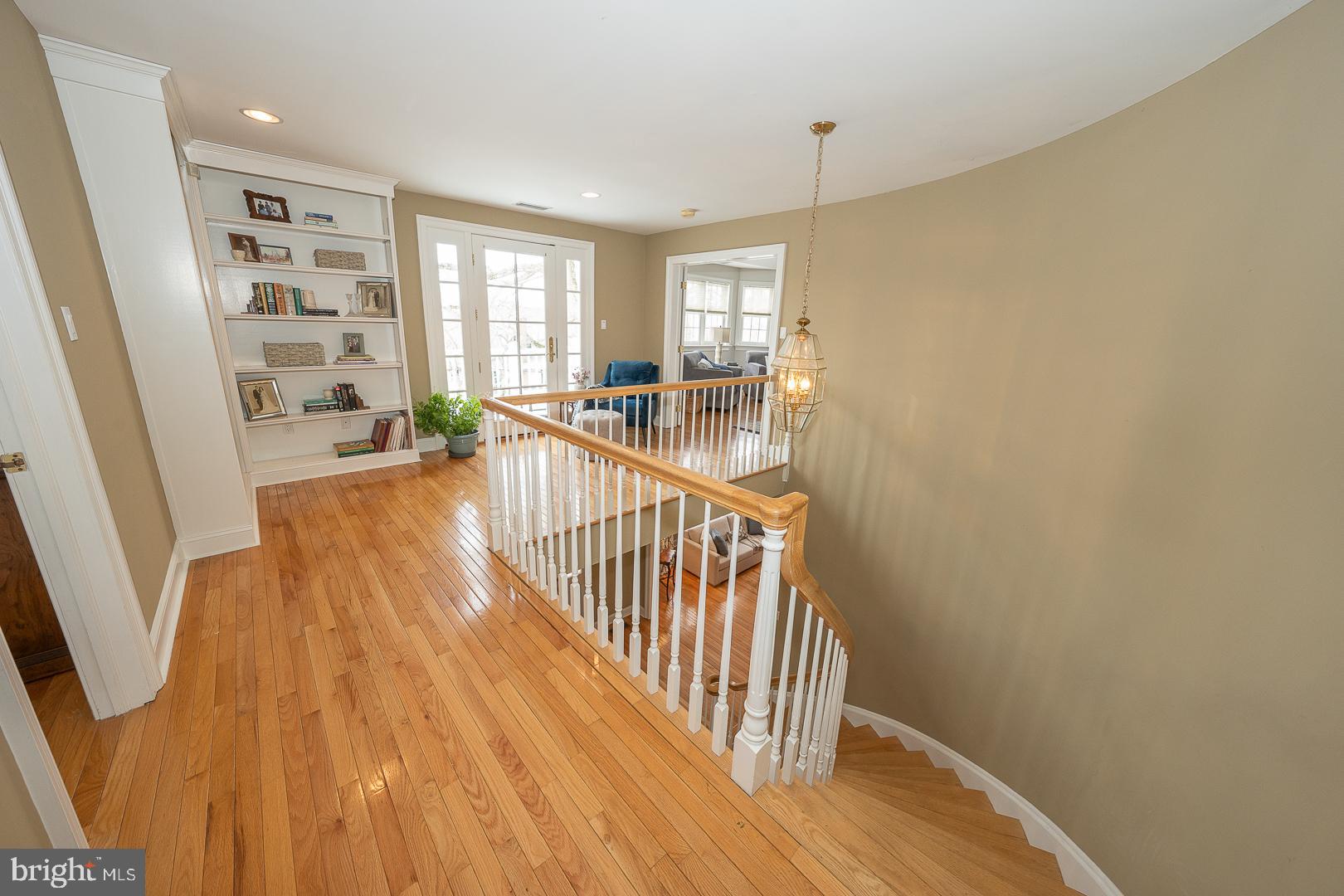 400 Orchard Way Wayne, PA 19087 - Photo 26 of 60 a view of a hallway with wooden floor and windows