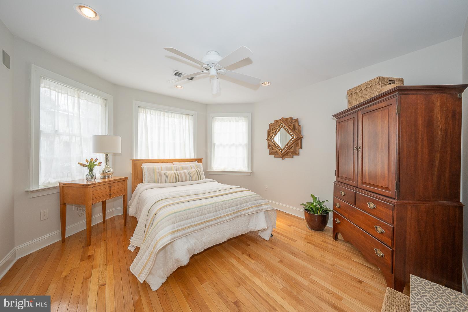 400 Orchard Way Wayne, PA 19087 - Photo 38 of 60 a spacious bedroom with a bed a dresser and windows